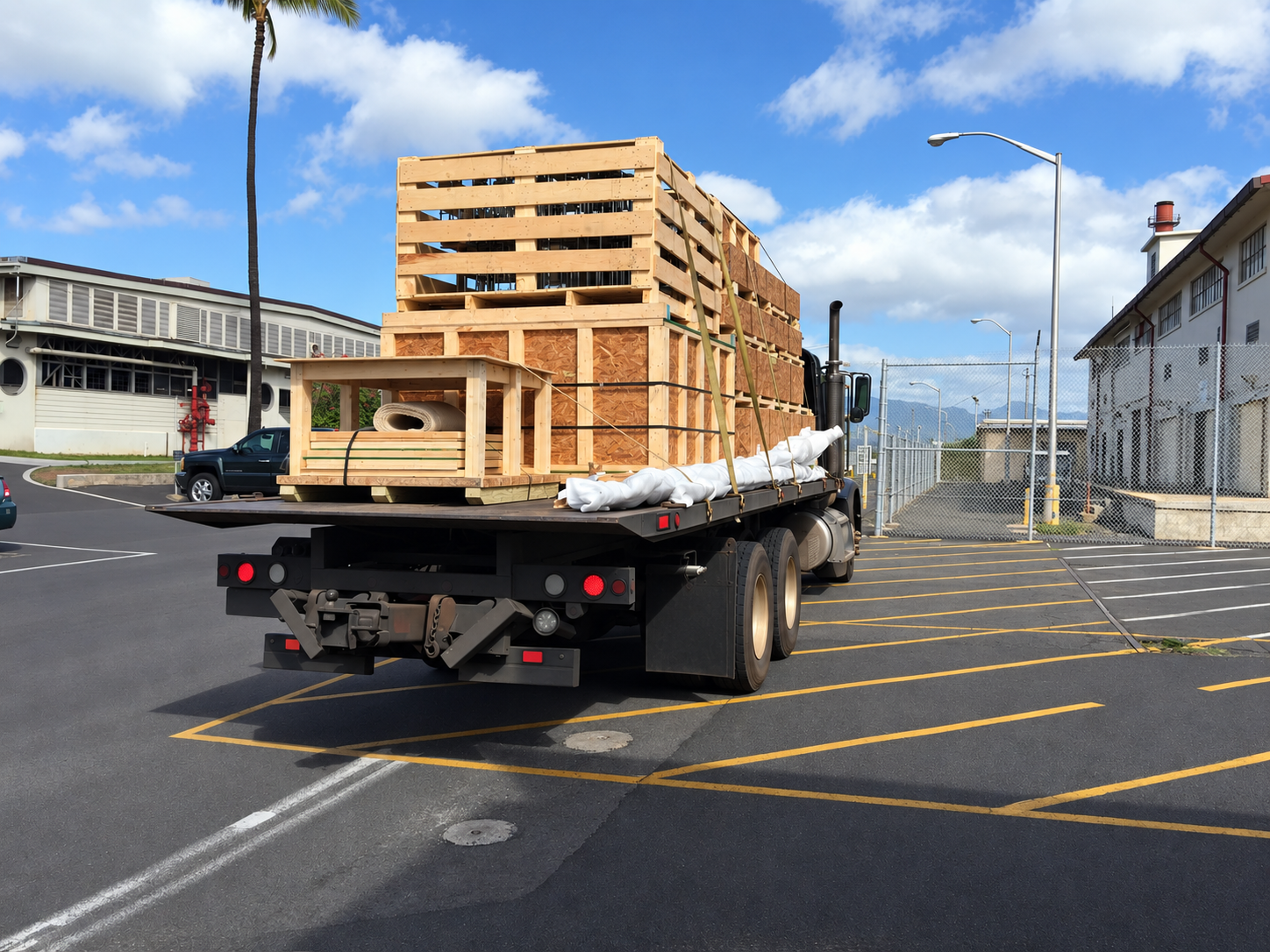 Custom wooden crated freight secured on a flatbed truck